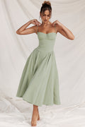 Elegant flattering midi dress in light green, front view