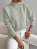 Soft knit turtleneck sweater in light green, front view