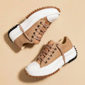 Saw-tooth platform high-top sneakers in sandstone beige, front view