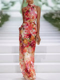 Open-back halter wedding guest dress in red, front view