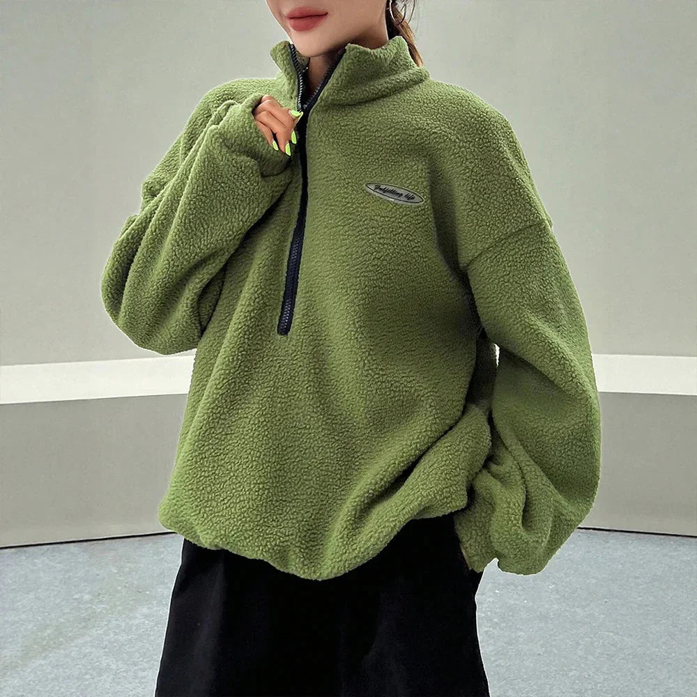 Half-zip fleece pullover in green, front view