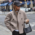Double-breasted stand collar jacket in beige, front view