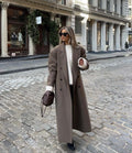 Double-breasted notched lapel maxi coat in brown, front view