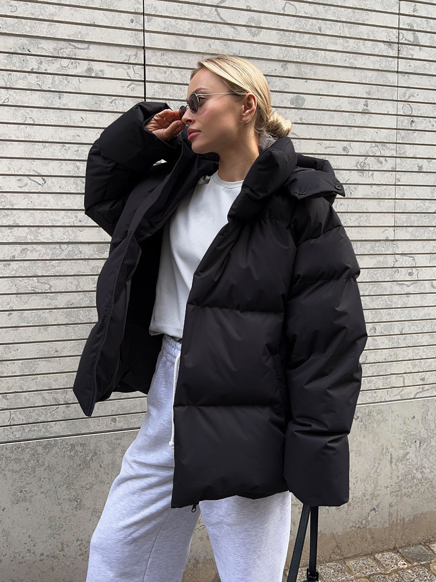 Hooded zip front puffer jacket in black, front view